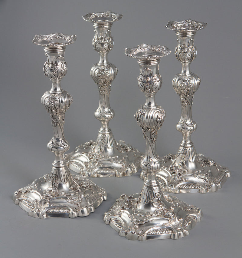 YSL Interest: A set of four cast George II Silver Rococo Candlesticks, London 1757 by John Perry