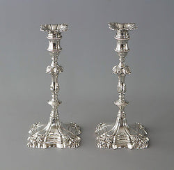 A Superb Pair of George II Cast Silver Candlesticks by William Cafe London 1757
