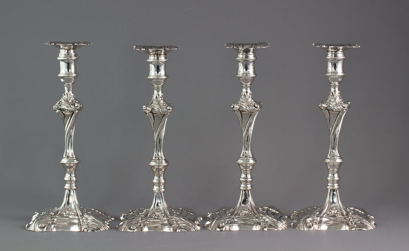 An Exceptional Set of Four Cast Silver Candlesticks London 1764/5