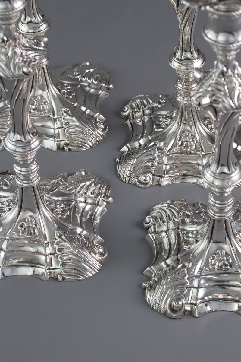 An Exceptional Set of Four Cast Silver Candlesticks London 1764/5