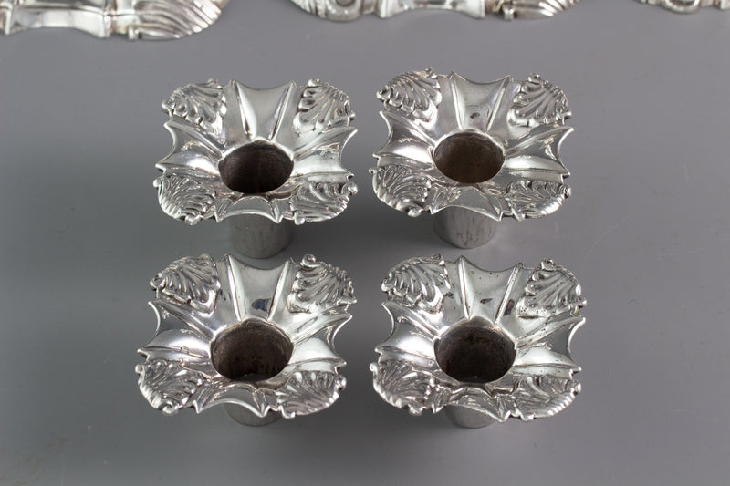 An Exceptional Set of Four Cast Silver Candlesticks London 1764/5