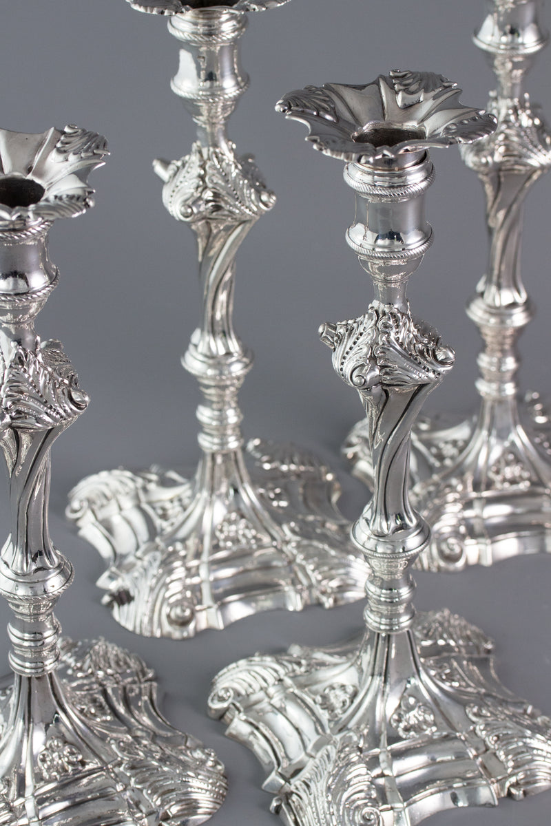 An Exceptional Set of Four Cast Silver Candlesticks London 1764/5