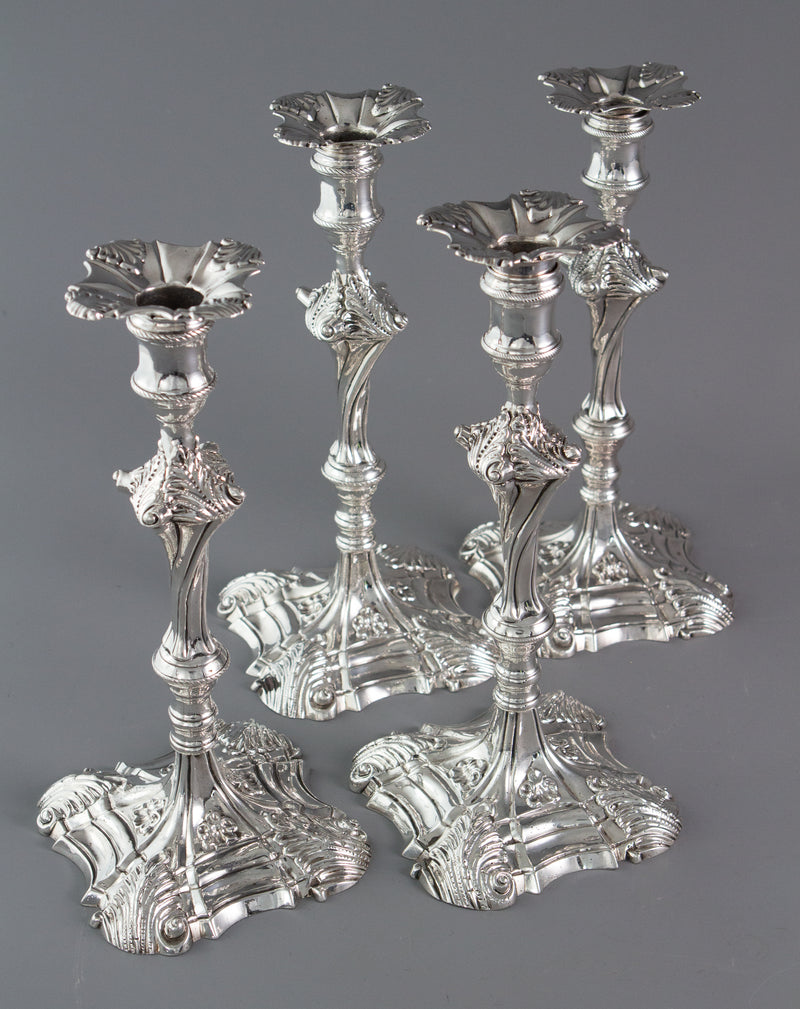 An Exceptional Set of Four Cast Silver Candlesticks London 1764/5