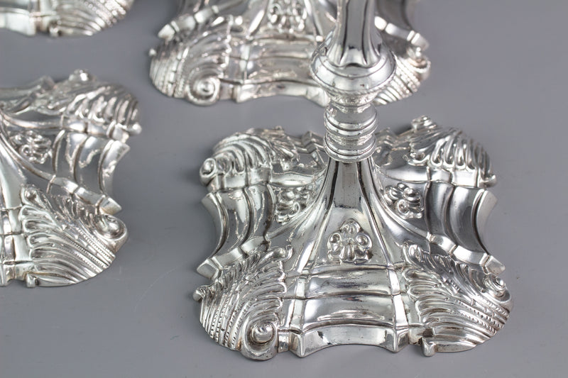 An Exceptional Set of Four Cast Silver Candlesticks London 1764/5