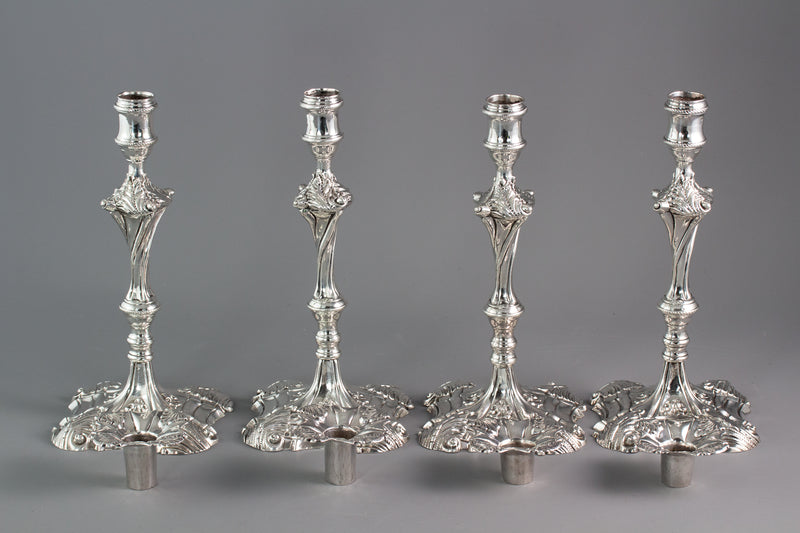 An Exceptional Set of Four Cast Silver Candlesticks London 1764/5