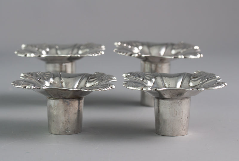 An Exceptional Set of Four Cast Silver Candlesticks London 1764/5