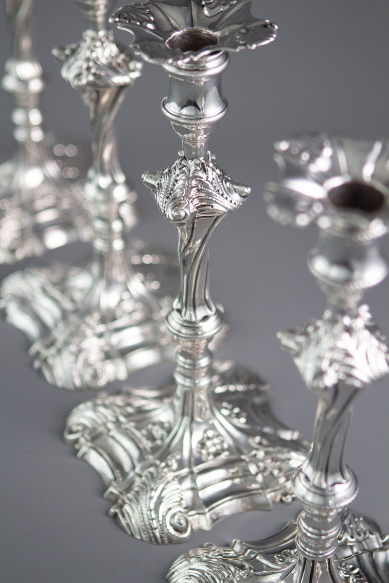 An Exceptional Set of Four Cast Silver Candlesticks London 1764/5