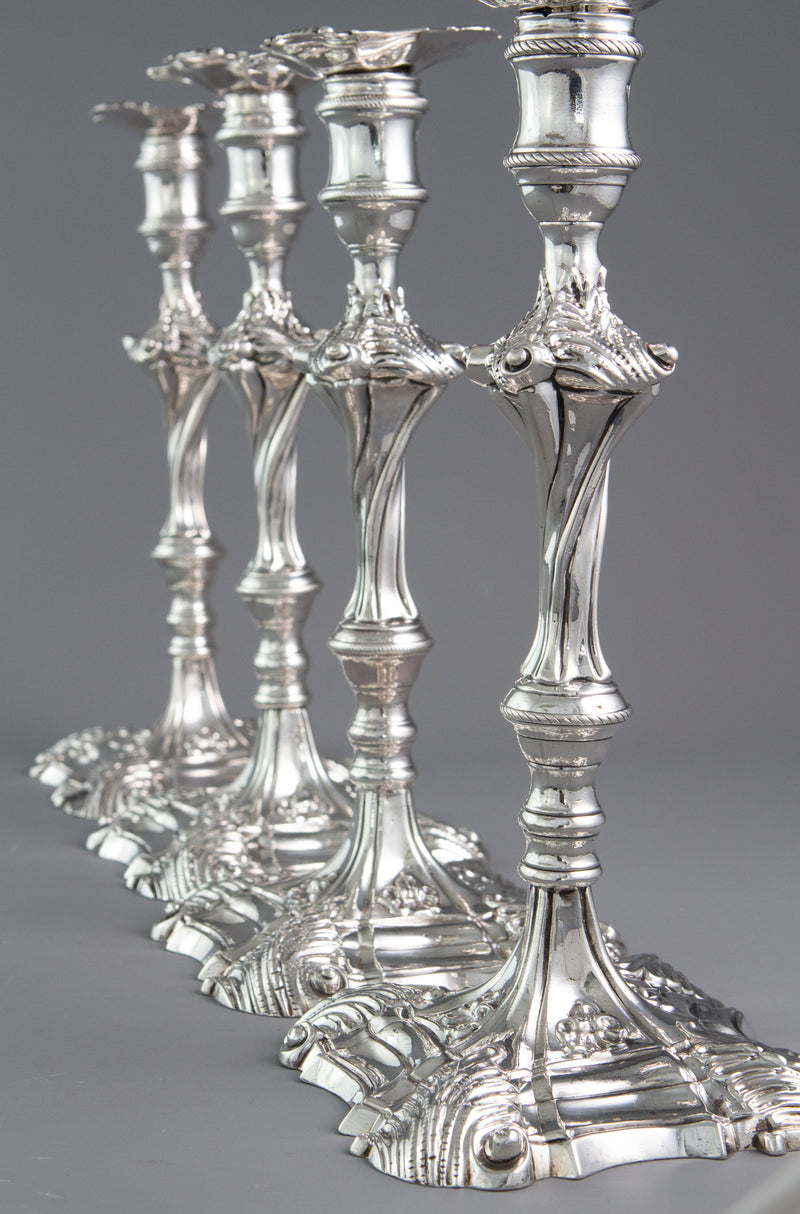 An Exceptional Set of Four Cast Silver Candlesticks London 1764/5