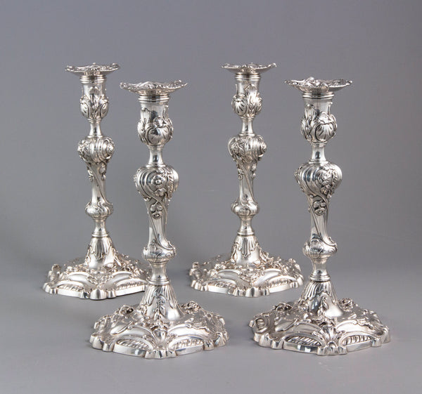 YSL Interest: A set of four cast George II Silver Rococo Candlesticks, London 1757 by John Perry