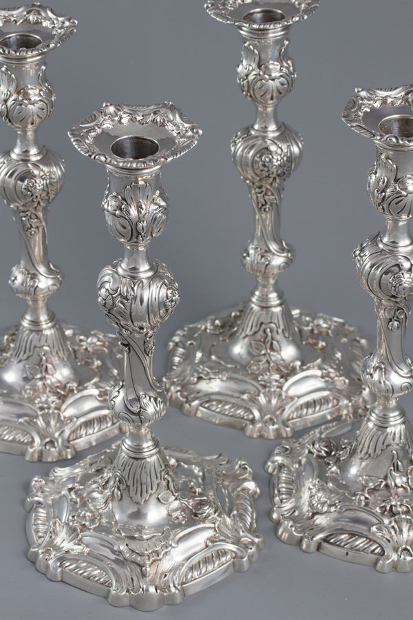 YSL Interest: A set of four cast George II Silver Rococo Candlesticks, London 1757 by John Perry