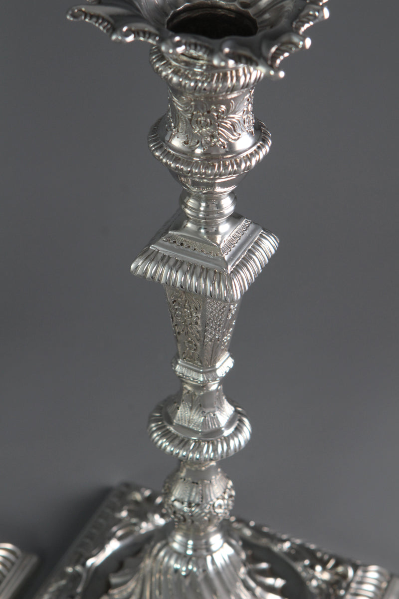 A Pair of Cast Silver Candlesticks by William Cafe London 1760