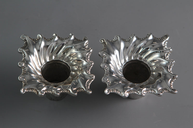 A Pair of Cast Silver Candlesticks by William Cafe London 1760
