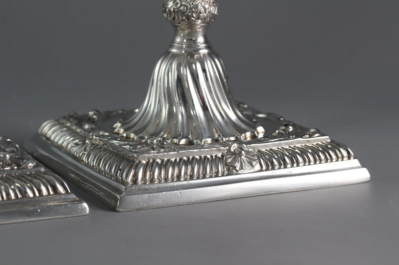 A Pair of Cast Silver Candlesticks by William Cafe London 1760