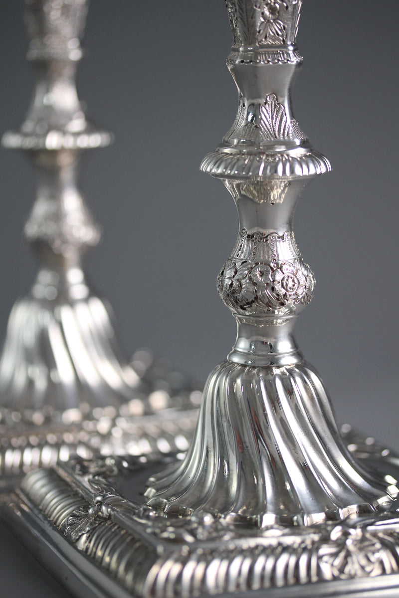 A Pair of Cast Silver Candlesticks by William Cafe London 1760