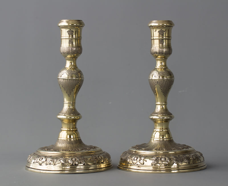 An Elegant Pair of Queen Anne/George I Silver-Gilt Cast Candlesticks by Matthew Cooper
