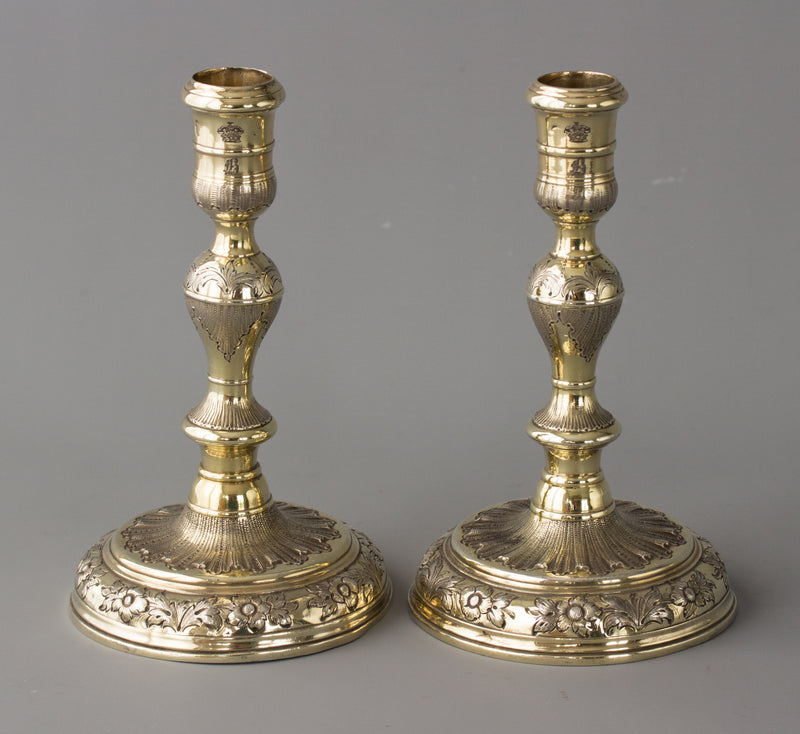 An Elegant Pair of Queen Anne/George I Silver-Gilt Cast Candlesticks by Matthew Cooper