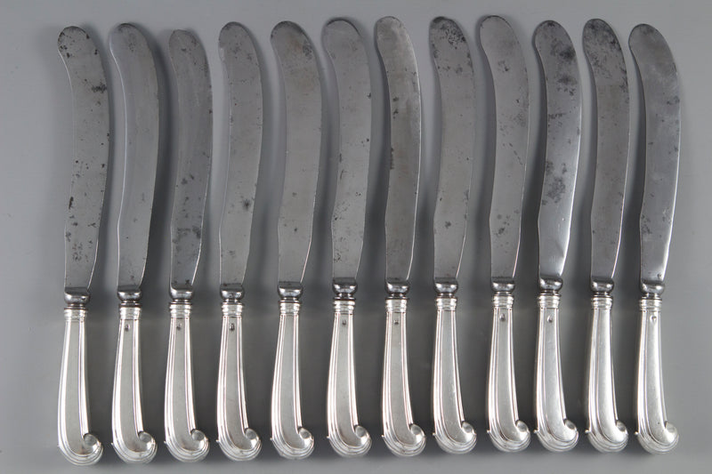 A Set of 12 Early Eighteenth Century Pistol Grip Table Knives
